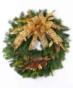Assorted, fresh mixed greens, such as cedar, white pine, douglas and silver fir are combined in this handcrafted wreath. A gold bow, pinecones and gold accents complete the design.